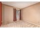 Neutral bedroom with window and patterned carpet at 325 E Sharon Ave, Phoenix, AZ 85022