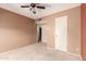 Bedroom with neutral colored walls, ceiling fan and lights at 325 E Sharon Ave, Phoenix, AZ 85022