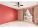 Bedroom with window and ceiling fan with lights at 325 E Sharon Ave, Phoenix, AZ 85022
