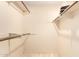A bright, empty closet with wood rods for hanging clothes at 325 E Sharon Ave, Phoenix, AZ 85022
