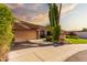 Charming home with a two-car garage, mature shade trees and well-manicured lawn at 325 E Sharon Ave, Phoenix, AZ 85022