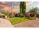 Charming home with a two-car garage, mature shade trees and well-manicured lawn at 325 E Sharon Ave, Phoenix, AZ 85022