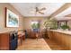 Cozy living area with wood accents, ceiling fan, artwork and large speakers at 325 E Sharon Ave, Phoenix, AZ 85022