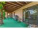 Covered patio space ideal for outdoor dining and relaxation, features a sliding glass door at 325 E Sharon Ave, Phoenix, AZ 85022
