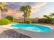A dazzling swimming pool is surrounded by lush landscaping and palm trees at 325 E Sharon Ave, Phoenix, AZ 85022