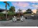 Outdoor space featuring a cozy fire pit, a covered lounge area and BBQ at 3445 E Pageant Pl, Gilbert, AZ 85297