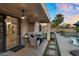 Backyard features a covered patio and access to a sparkling pool and spa at 3445 E Pageant Pl, Gilbert, AZ 85297