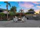 Outdoor space featuring a cozy fire pit, a covered lounge area and BBQ at 3445 E Pageant Pl, Gilbert, AZ 85297