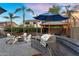 Outdoor space featuring a cozy fire pit, a covered lounge area and BBQ at 3445 E Pageant Pl, Gilbert, AZ 85297