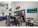 Recreation area with custom bar, seating, TV, and foosball table on tile floor at 3445 E Pageant Pl, Gilbert, AZ 85297