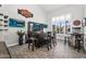 Bar area features a custom bar with TVs, seating, and tile flooring at 3445 E Pageant Pl, Gilbert, AZ 85297