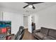 This bedroom includes a ceiling fan, tv, and a sliding door closet at 3445 E Pageant Pl, Gilbert, AZ 85297