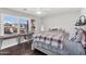 This bedroom features a desk, chair, and window with plantation shutters at 3445 E Pageant Pl, Gilbert, AZ 85297