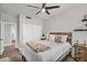 Comfortable bedroom with modern decor, a ceiling fan, and bright natural light at 3445 E Pageant Pl, Gilbert, AZ 85297