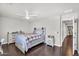 This bedroom has wood floors and rustic furniture at 3445 E Pageant Pl, Gilbert, AZ 85297