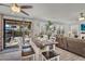Dining area with seating for four, and sliding glass doors leading to the outdoor patio at 3445 E Pageant Pl, Gilbert, AZ 85297