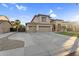 Spacious two-story home with a three-car garage and large driveway at 3445 E Pageant Pl, Gilbert, AZ 85297