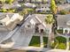 Stunning home featuring a well-manicured lawn, mature palm trees, and a spacious three-car garage at 3445 E Pageant Pl, Gilbert, AZ 85297