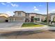 Charming two-story home with three-car garage and well-manicured front yard at 3445 E Pageant Pl, Gilbert, AZ 85297