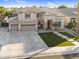 Magnificent two-story home with a three-car garage, landscaped front yard, and inviting curb appeal at 3445 E Pageant Pl, Gilbert, AZ 85297