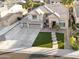 Beautiful two-story home featuring a three car garage, manicured lawn and walkway at 3445 E Pageant Pl, Gilbert, AZ 85297