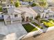 Immaculate two-story home featuring a three-car garage and a well-manicured lawn at 3445 E Pageant Pl, Gilbert, AZ 85297
