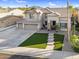 Stunning two-story home featuring a three car garage and a welcoming front porch at 3445 E Pageant Pl, Gilbert, AZ 85297