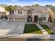 Beautiful two-story home with a three-car garage and well-manicured lawn in a lovely neighborhood at 3445 E Pageant Pl, Gilbert, AZ 85297