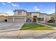 Charming two-story home with three-car garage and well-manicured front yard at 3445 E Pageant Pl, Gilbert, AZ 85297