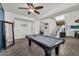 Spacious game room includes pool table, stairs to second level, and access to other living areas at 3445 E Pageant Pl, Gilbert, AZ 85297