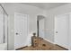 Hallway with decorative console table between doors at 3445 E Pageant Pl, Gilbert, AZ 85297
