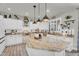 Bright kitchen featuring an island, granite counters, stainless steel appliances, and contemporary pendant lighting at 3445 E Pageant Pl, Gilbert, AZ 85297