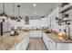 Bright and spacious kitchen with a large island featuring granite countertops, stainless steel appliances and an open design at 3445 E Pageant Pl, Gilbert, AZ 85297