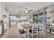 Bright open kitchen with white cabinets, an island, and a connected dining area, perfect for Gathering meals and entertaining at 3445 E Pageant Pl, Gilbert, AZ 85297
