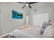 This main bedroom features a ceiling fan, tv, and a full sized bed at 3445 E Pageant Pl, Gilbert, AZ 85297