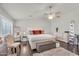 Bright main bedroom with neutral colors, a plush rug, and ample closet space at 3445 E Pageant Pl, Gilbert, AZ 85297