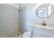 Updated bathroom featuring a sleek glass-enclosed shower and modern vanity, plus neutral color scheme at 3722 W Michelle Dr, Glendale, AZ 85308
