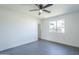 This bedroom features neutral walls, tile flooring, a ceiling fan, and a window for natural light at 3722 W Michelle Dr, Glendale, AZ 85308