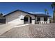 Single-story home showcasing a well-maintained front yard with desert landscaping and a two-car garage at 3722 W Michelle Dr, Glendale, AZ 85308