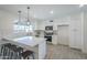 Modern kitchen features an island with seating, stainless steel appliances, and light countertops, perfect for cooking at 3722 W Michelle Dr, Glendale, AZ 85308