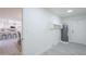 Entry to the laundry room with view to the kitchen with breakfast bar at 3722 W Michelle Dr, Glendale, AZ 85308