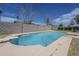 Backyard pool with diving board surrounded by block wall and partial view of the home at 3722 W Michelle Dr, Glendale, AZ 85308