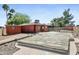 Backyard featuring the exterior of home, pool cover, palms, and fenced area at 3836 W Desert Cove Ave, Phoenix, AZ 85029