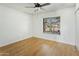 Clean bedroom featuring wood floors, white walls and a window overlooking the street at 3836 W Desert Cove Ave, Phoenix, AZ 85029