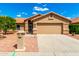 Charming single-story home with a well-maintained lawn and a two-car garage at 3971 N 151St Ln, Goodyear, AZ 85395