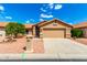Inviting single-story home with a well-manicured front yard and a convenient two-car garage at 3971 N 151St Ln, Goodyear, AZ 85395