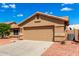 Attractive house showcasing a two-car garage and vibrant desert landscaping at 3971 N 151St Ln, Goodyear, AZ 85395