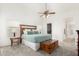 Tranquil main bedroom featuring a ceiling fan, soft carpet, and a window for natural light at 3971 N 151St Ln, Goodyear, AZ 85395