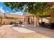 Expansive covered patio overlooking a beautifully landscaped backyard offering a serene outdoor living space at 3971 N 151St Ln, Goodyear, AZ 85395