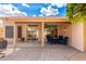 Inviting covered patio with tile flooring perfect for outdoor relaxation and entertaining with comfortable seating at 3971 N 151St Ln, Goodyear, AZ 85395